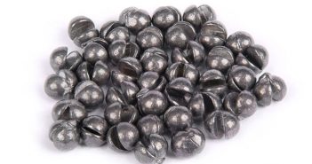 A pile of black beads on a white background.