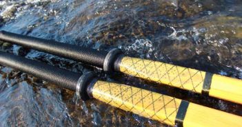 A pair of fishing rods in the water.