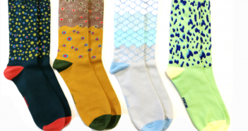 Four pairs of socks with different designs on them.