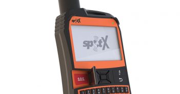 An orange and black cell phone with the word spx on it.