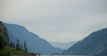 A large body of water with mountains in the background.