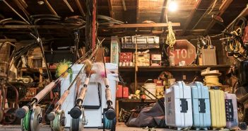 A collection of fishing equipment in a garage.