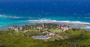 A view of a tropical island and the ocean.