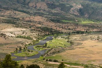 A valley with a river running through it.