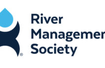 Logo for River Management Society featuring a blue water drop above a dark blue abstract shape resembling a river or waves, accompanied by the text "River Management Society.