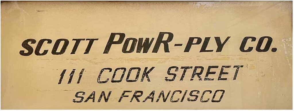 Sign reads "Scott Powr-Ply Co., 111 Cook Street, San Francisco" in bold, black lettering on a beige background.