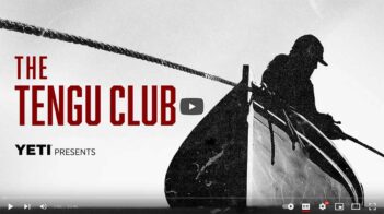 A silhouetted person on a boat featured in the video thumbnail titled "The Tengu Club" presented by YETI.