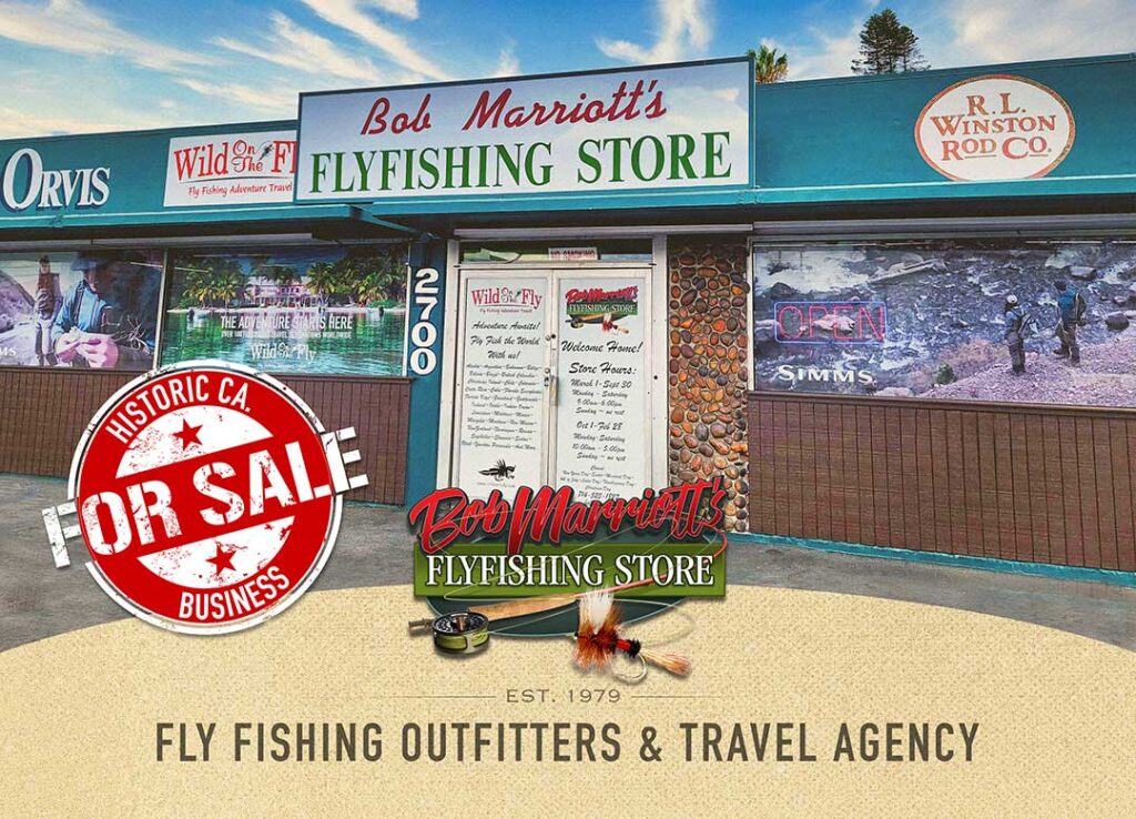 Exterior of Bob Marriott's Fly Fishing Store, featuring fly fishing gear signage, travel agency services, and a "For Sale" sign. Established in 1979.