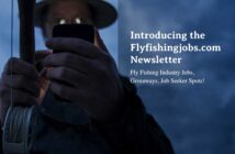 Person in a hat holding a fishing rod looks at a phone. Text on image promotes Flyfishingjobs.com newsletter for industry jobs, giveaways, and job seeker spots.