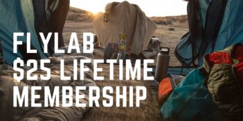 Camping gear inside a tent with a view of the sunrise. Text reads, "Flylab $25 Lifetime Membership.