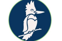 Stylized white bird resembling a kingfisher, perched on a branch, set against a blue circular background with a thin green border.