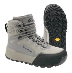 A pair of gray Skwala hiking boots with black Vibram soles; one boot is upright while the other shows the tread pattern on the sole.